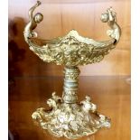 A Continental gilt bronze / brass cherub comport, H. 21cm, W. 18cm.