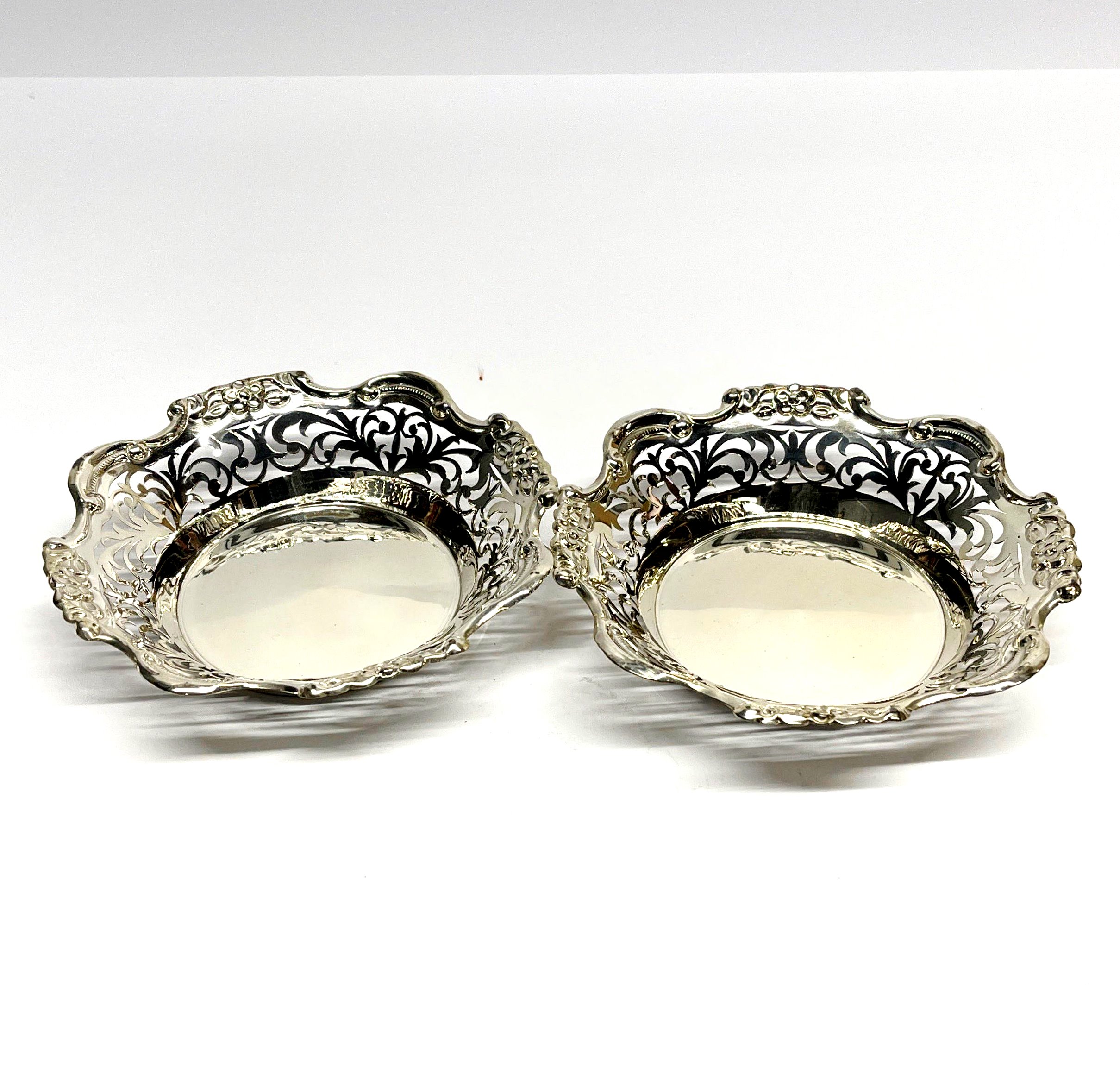 A pair of pierced silver dishes, Dia. 15cm, stamped silver and tested.