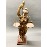 A large cast bronze figure of Justice on a wooden base, H. 74cm.