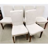 A set of six modern cream velvet upholstered dining chairs.