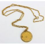 A 1982 South African gold pound coin, 2.5cm, on a 9ct chain.