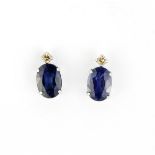 A pair of 900 platinum stud earrings set with oval cut sapphires and diamonds, L. 0.9cm.