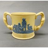A 19th century English pottery hunting cup, with greyhound handles, H. 13cm, W. 23cm.