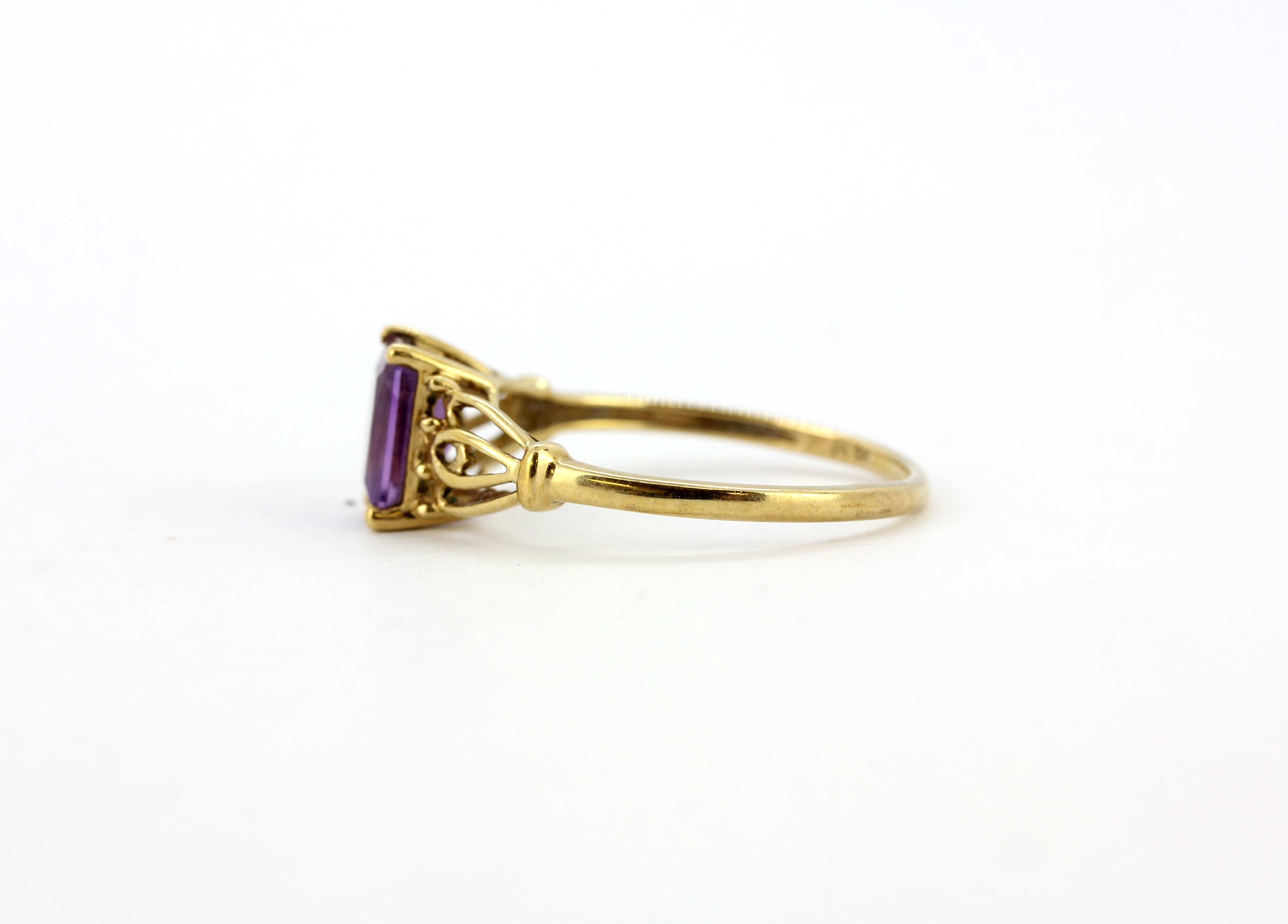 A 9ct yellow gold ring set with emerald cut amethyst, (T.5). - Image 2 of 2
