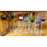 A collection of good coloured stem glasses by Artland and others.