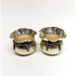 A pair of silver basket shaped bowls, Dia. 8.5cm, H. 6cm. Stamped silver and tested.