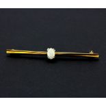 An 18ct yellow gold (stamped 18ct) opal set barr brooch, L. 6.4cm.