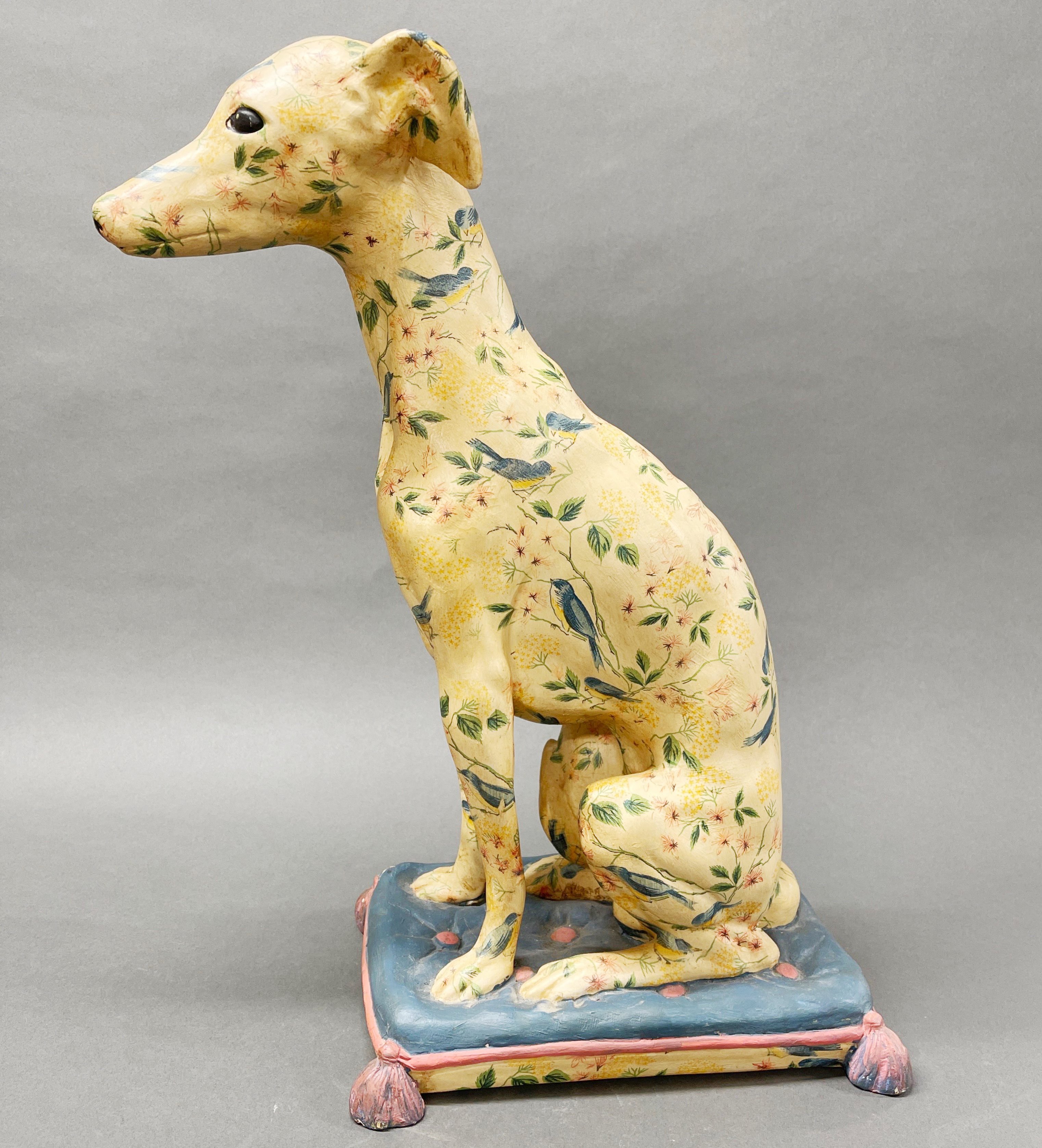 A large painted plaster figure of a dog sitting on a cushion, H. 54cm, slightly A/F to back tassle. - Image 2 of 3