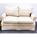 A cream upholstered three piece suite, largest 138 x 75cm.