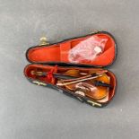 A miniature cased violin, H. 15cm.