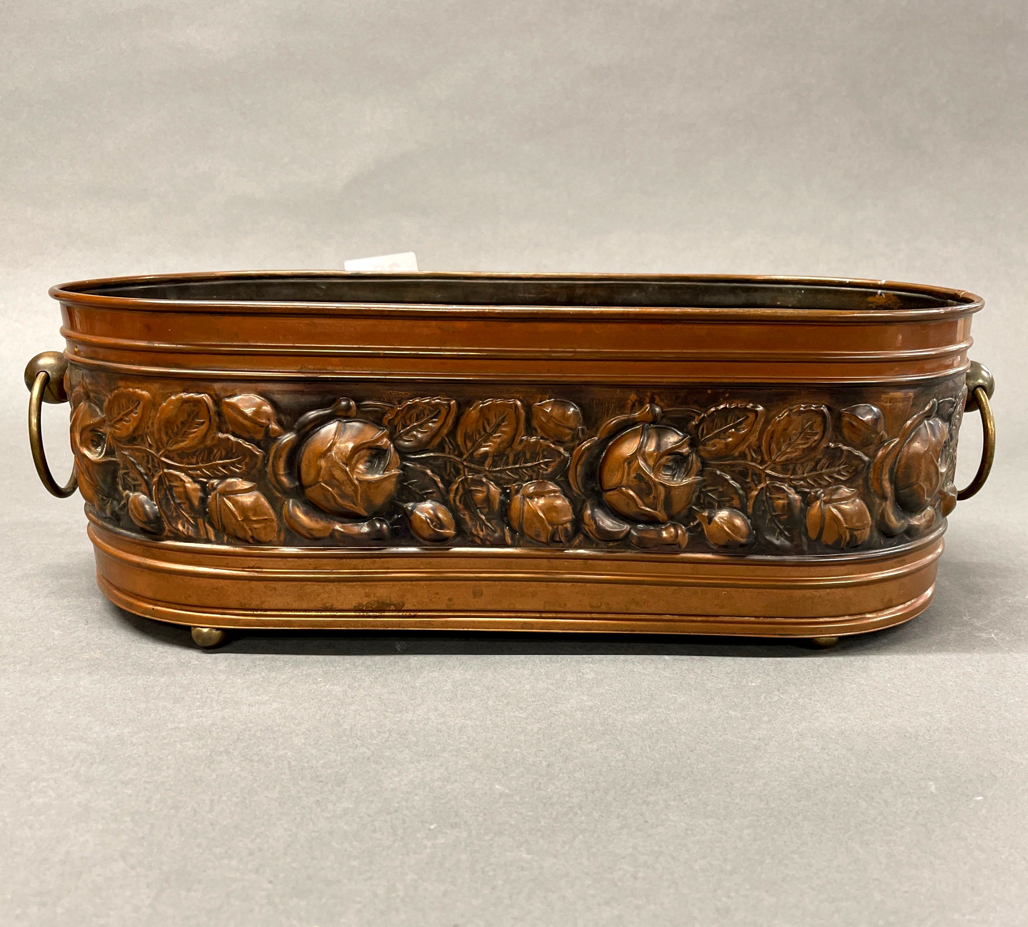 A hammered copper planter, W. 46cm.