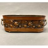 A hammered copper planter, W. 46cm.