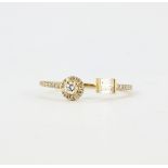 An 18ct yellow gold (stamped 750) ring set with baguette and brilliant cut diamonds, (O).