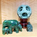A Chinese carved hardstone ball in ball with stand, H. 14cm, together with a jade elephant and