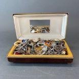 A box of mixed costume jewellery.