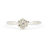 A 9ct white gold cluster ring set with brilliant cut diamonds, ring size O.