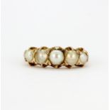 A 9ct yellow gold (stamped 9ct) pearl set ring, (M).