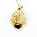 A 9ct yellow gold locket and chain, L. 2.8cm.