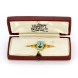 An 18ct yellow gold enamelled brooch in its original box, L. 4cm.