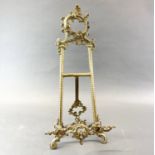 A useful ornate brass easel, H. 54cm.