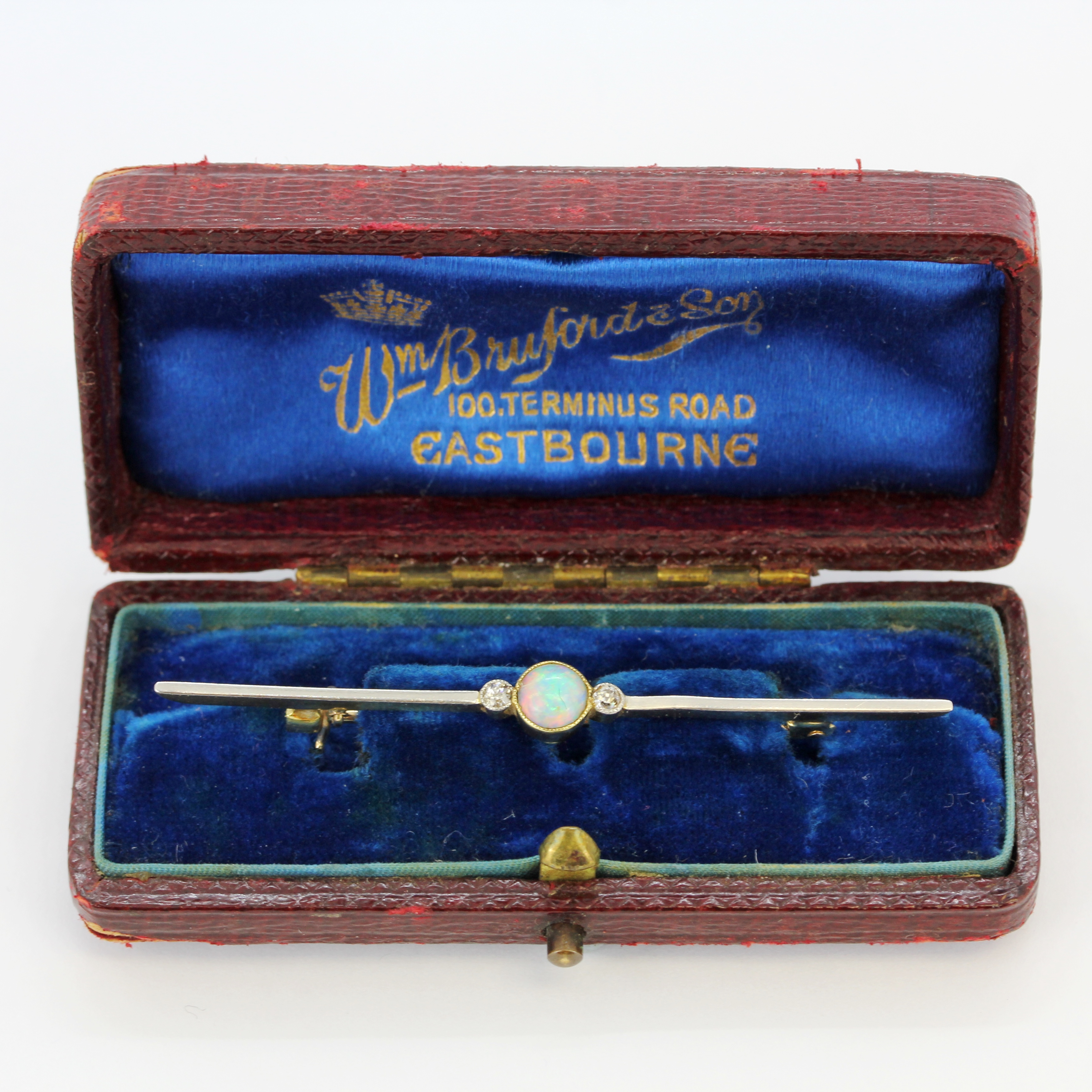 A 15ct yellow and white gold opal and diamond set bar brooch, with 9ct yellow gold (stamped 9ct)