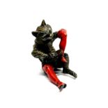 A cold painted Vienna bronze of Puss cleaning his boots, H. 7cm.