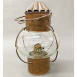 A ship's copper oil lamp, H. 35cm.