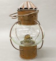 A ship's copper oil lamp, H. 35cm.