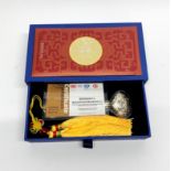 A boxed 999 silver enamelled ruyi sceptre with certificate. Ruyi L. 12.5cm.