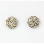 A pair of 18ct white gold (stamped 18k) cluster earrings set with brilliant cut diamonds, approx.