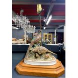 A wood and porcelain bird table lamp, H. 47cm, W. 35cm.