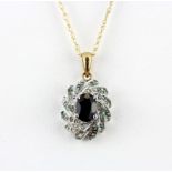 A 9ct yellow gold pendant and chain set with an oval cut sapphire and diamonds.