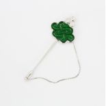 A boxed 14ct white gold (stamped 14k) carved jade and diamond set stick pin, 7cm.