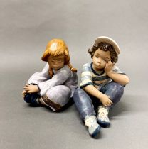 Two boxed Lladro figures of children. H. 19cm