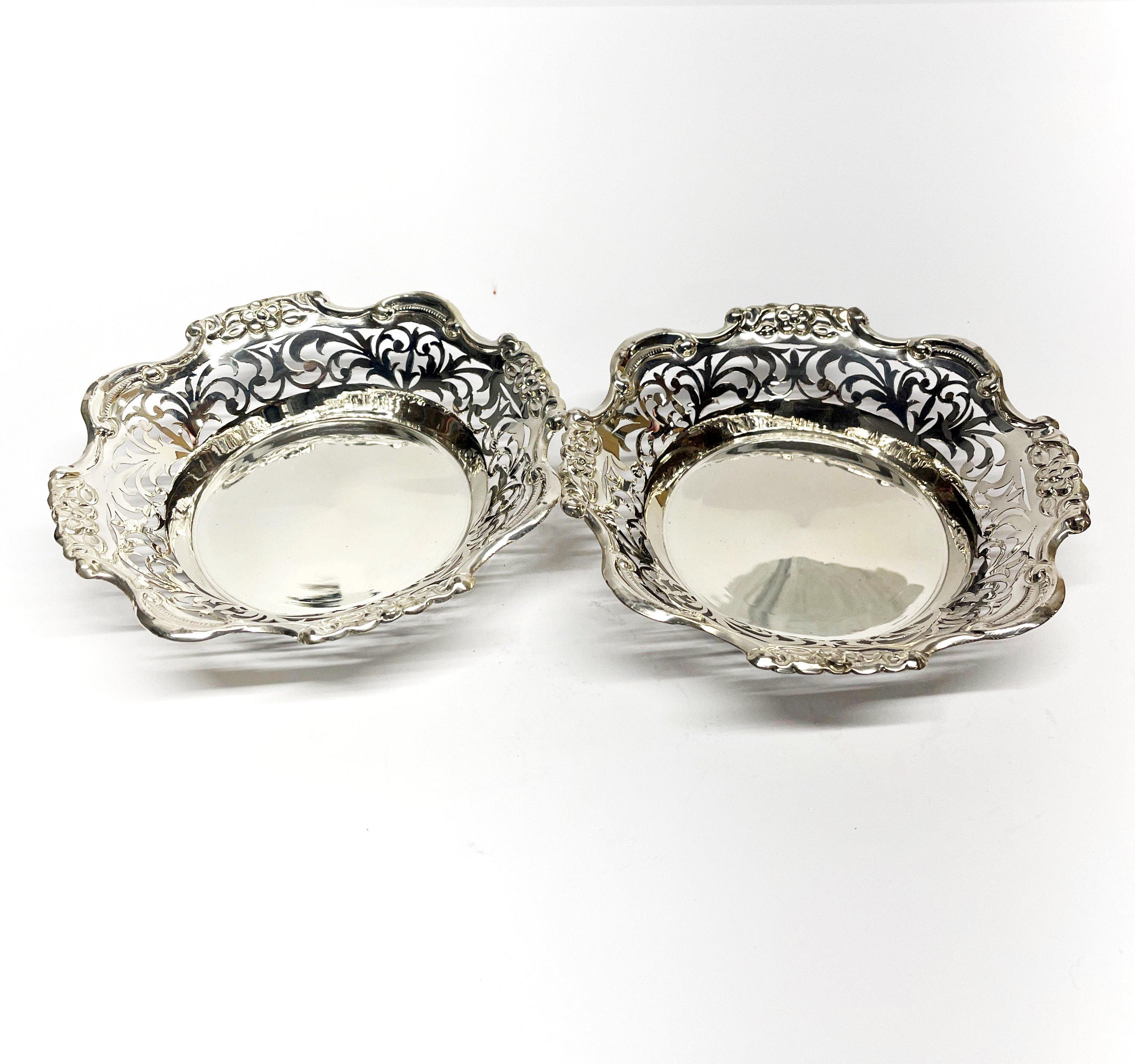 A pair of pierced silver dishes, Dia. 15cm, stamped silver and tested. - Image 2 of 3