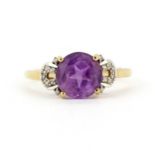 A 9ct yellow gold amethyst and diamond set ring, (T.5).