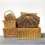 A group of useful cane baskets, largest 47 x 35 x 30cm.