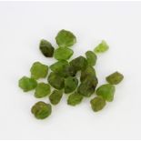 A quantity of rough peridots, approx. 254ct.