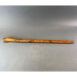 A Japanese carved bamboo walking stick, L. 90cm.