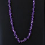 An amethyst beaded necklace, L. 34cm.