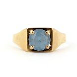 A 9ct yellow gold ring set with a blue stone, (T.5).