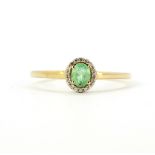 A 9ct yellow gold green stone and diamond set cluster ring (T.5).