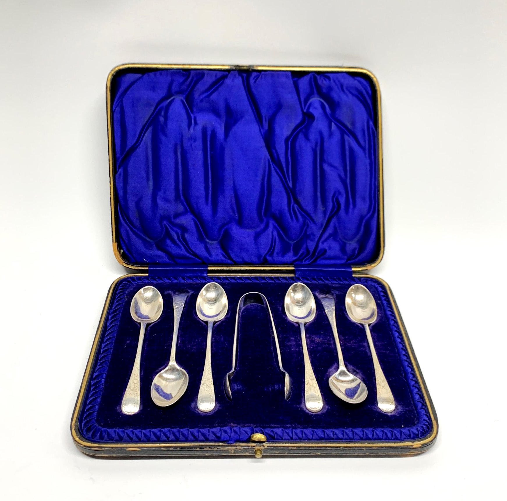 A cased set of hallmarked silver spoons and sugar tongs.