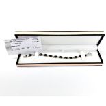 A silver and approx. 1.70ct black diamond bracelet with certificate.