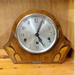 An Art Deco chiming wooden mantel clock, H. 22cm.