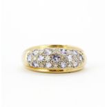 A 14ct yellow and white gold (stamped 14k) pave set ring set with tanzanites and diamonds, (N).