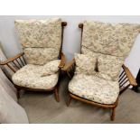An Ercol three piece conservatory suite with floral upholstery.