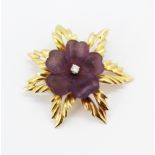 A boxed Garrard & Co 18ct yellow gold flower shaped brooch / pendant set with a carved amethyst