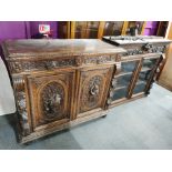 A 19th century carved oak display cabinet, total H. 242cm W. 125cm. A/F to carved deer decoration.