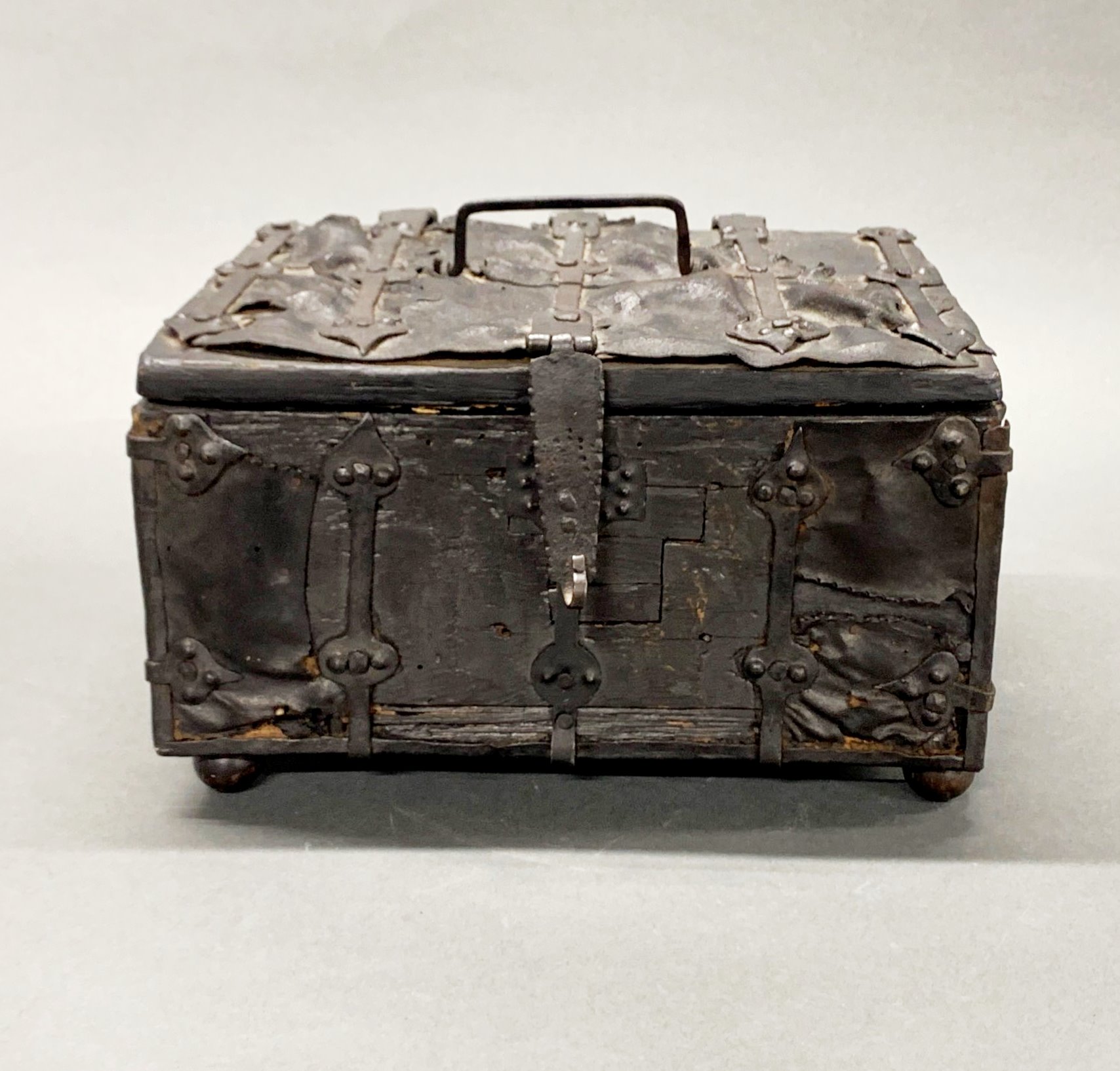 A rare Jacobean iron bound and leather covered wooden chest, 27 x 21 x 16cm.